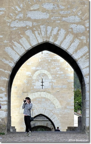 Photographer on Pont Valentré, Cahors, Dordogne, France