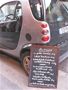 Menu leaning on Smart Car, Paris
