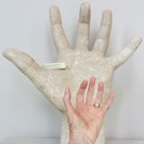 Comparing hands with sculpture, Paris