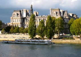 Seine cruise boat passing the Hotel de Ville, Paris
